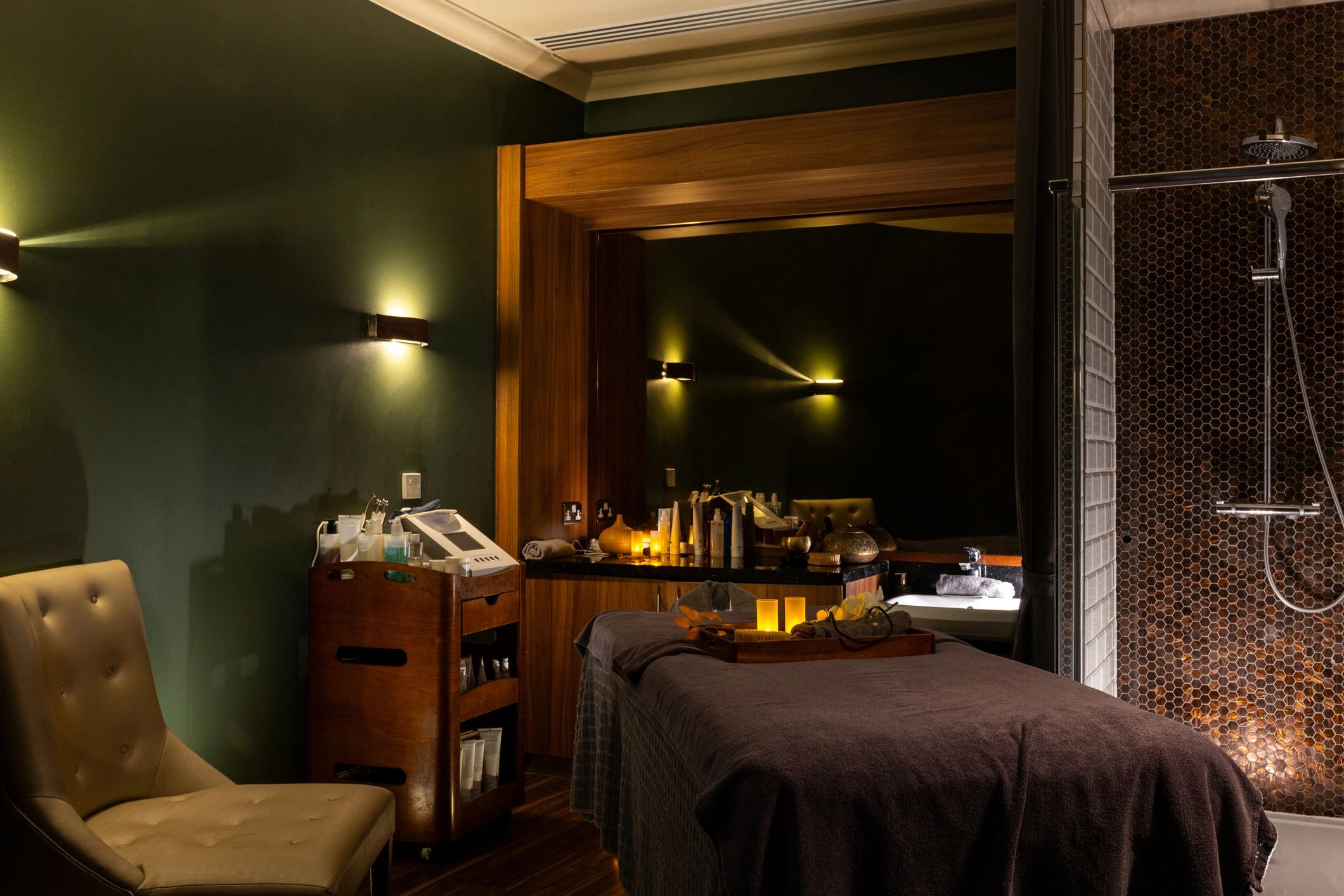 Warm spa treatment room with massage bed