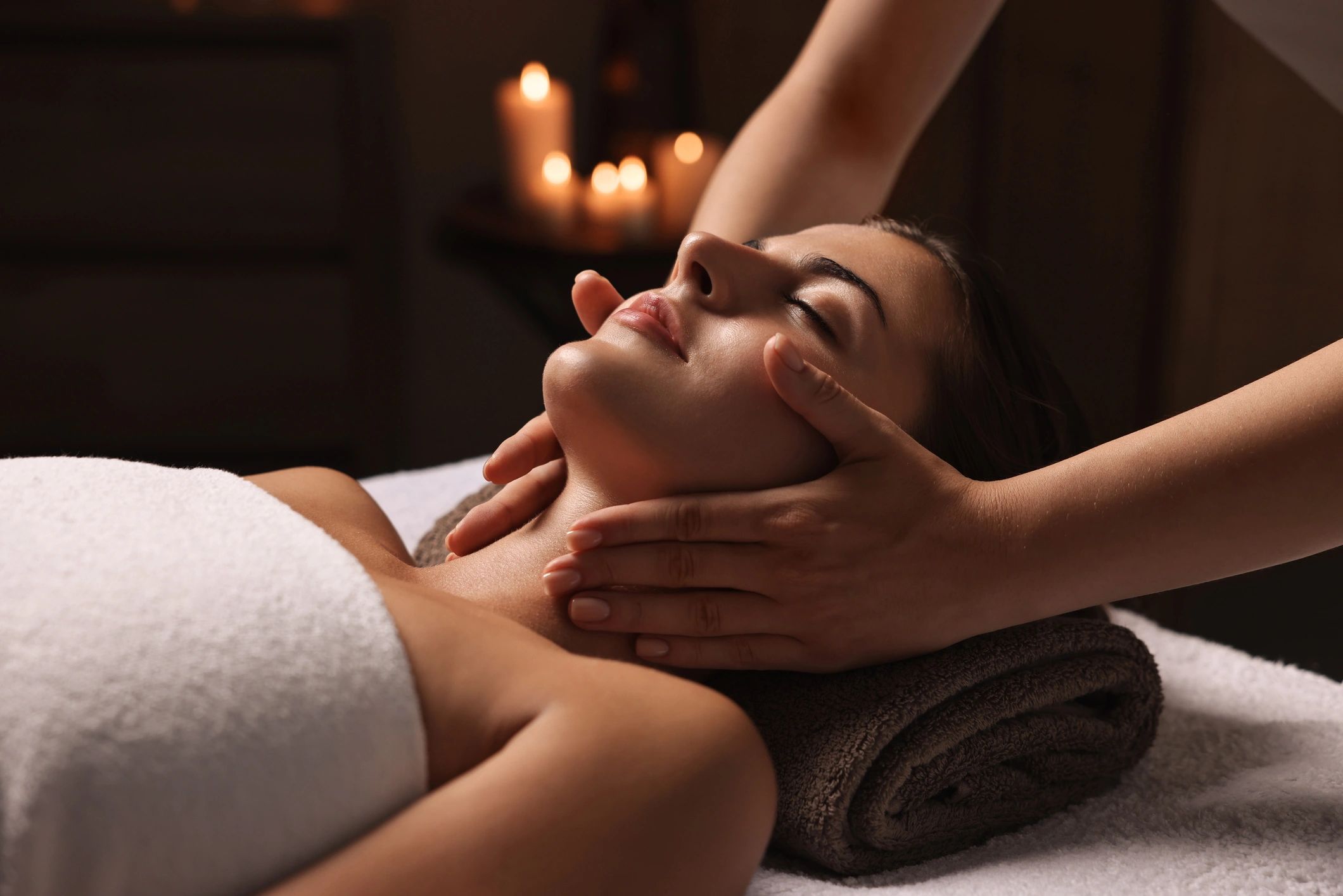 Woman enjoying a face massage treatment