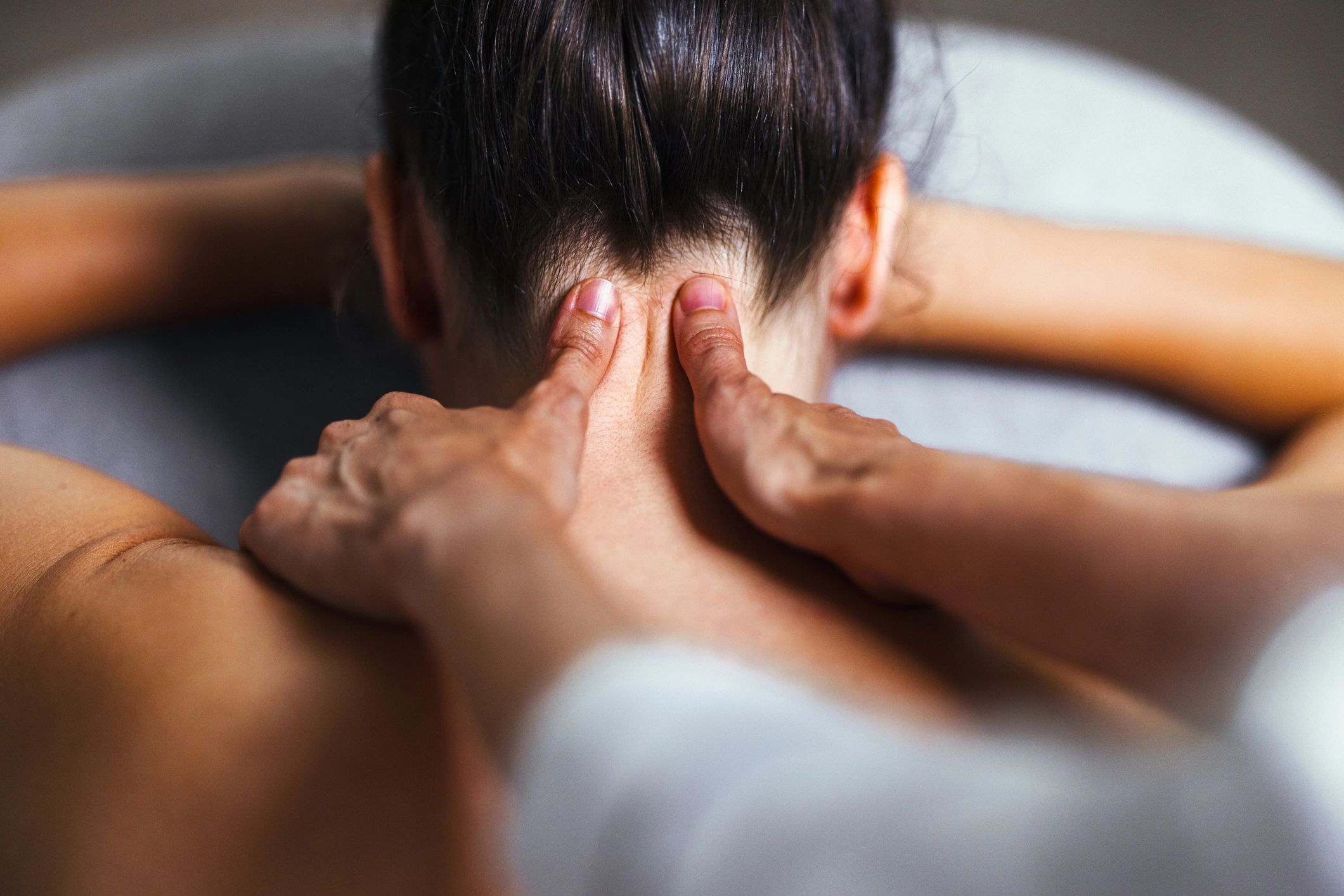 Relaxing neck and shoulder massage in a spa setting