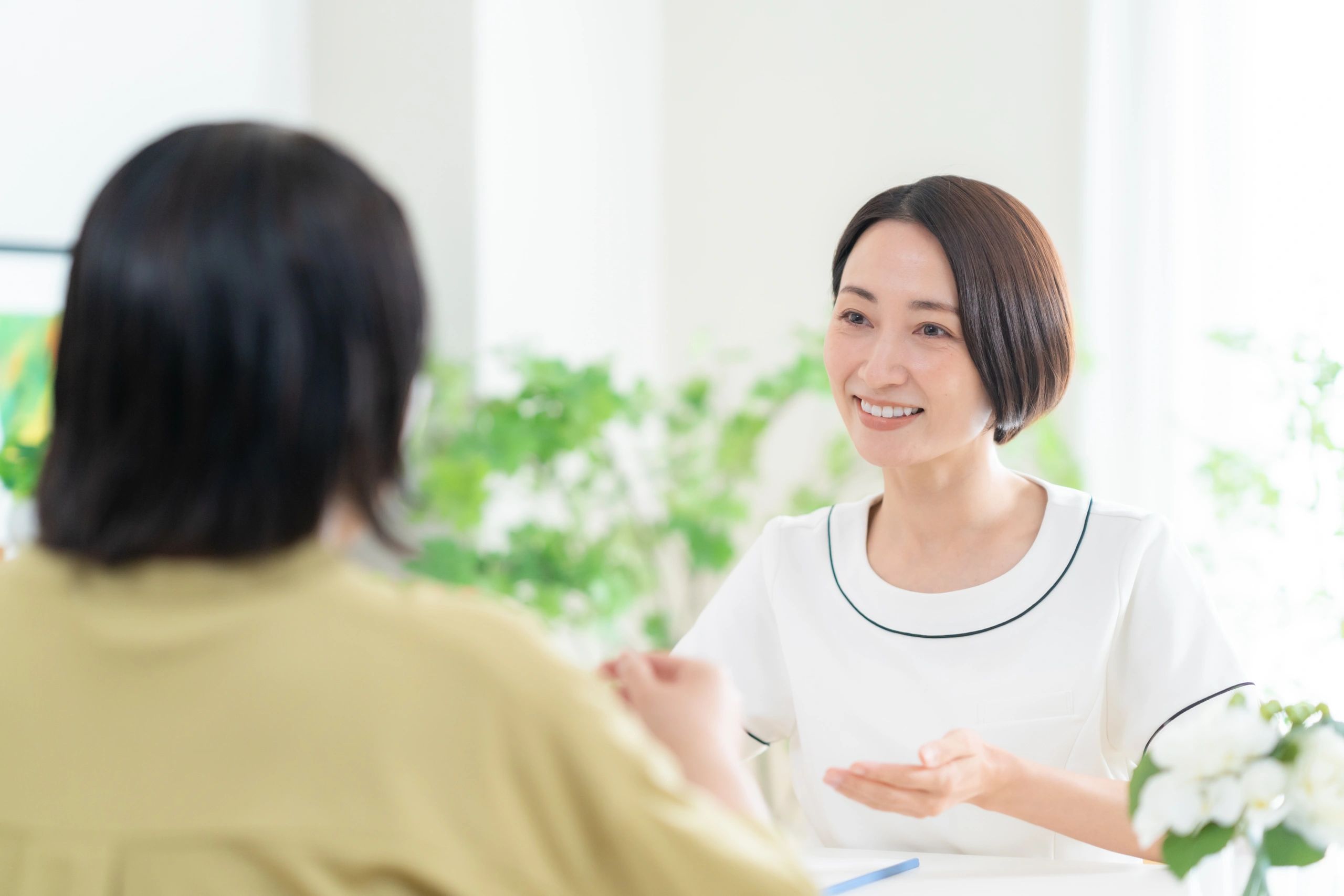 Spa professional consulting with a client